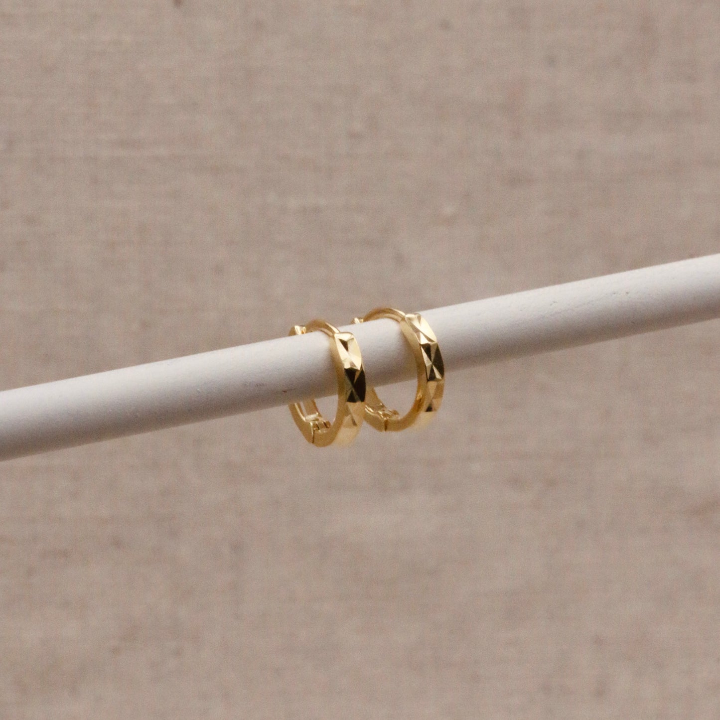 Load image into Gallery viewer, Gold Faceted Huggie Hoops
