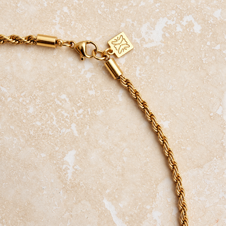 Clasp of the gold rope choker with the Little Nell branded tag