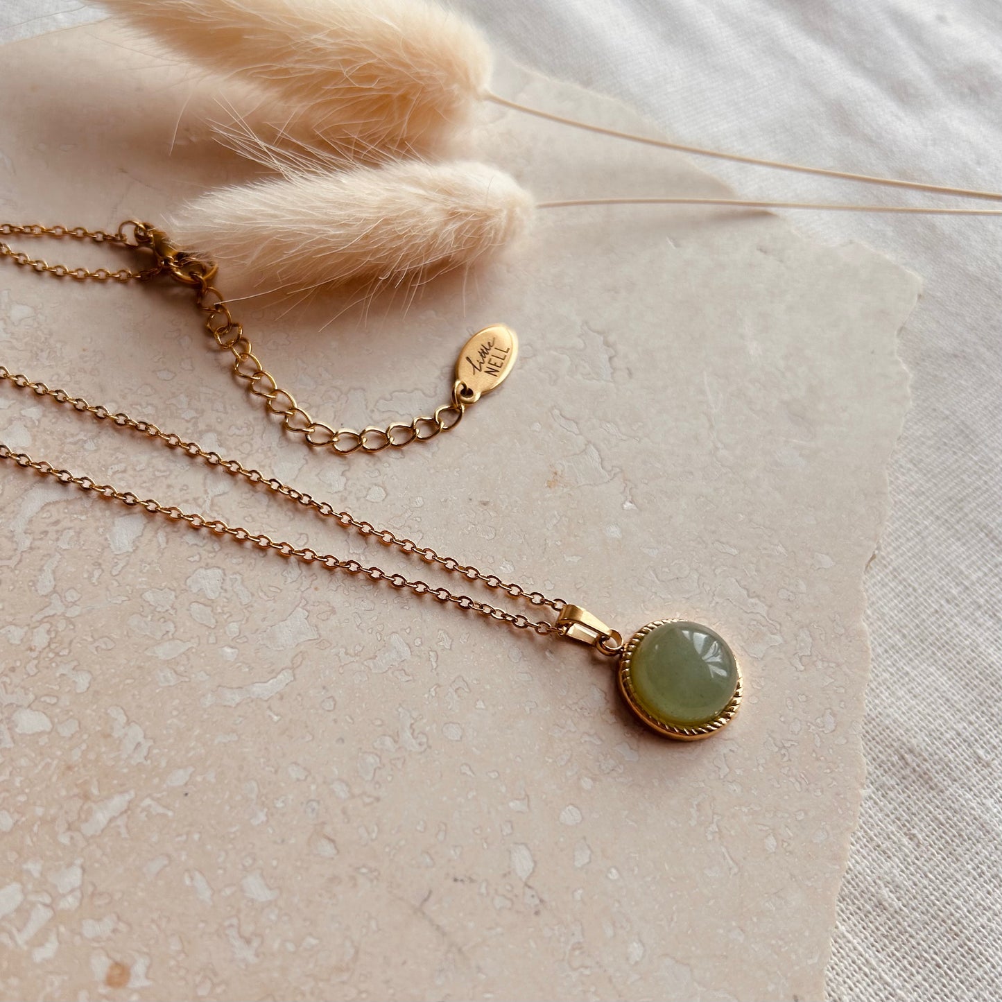 Gold necklace with jade pendant on sale